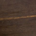 Angle focusing on edge of oak tabletop showing smooth rounded finish