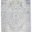 Rectangular traditional rug with center medallion and floral motifs in light gray, ivory, and dark blue