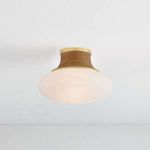 Pearl River flush mount ceiling light installed on white ceiling, glowing soft warm light