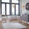 Boulevardier Bar Cart positioned in a spacious bathroom with large black window frames and wooden floor