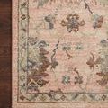 Close-up detail of Giada Blush rug corner showing textured weave and subtle fringe with wood floor background