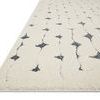 Side view showing low profile and thick pile texture of Hagen white and navy rug
