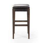 Aya Stool front view against white background revealing leather seat and footrest bars