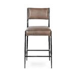 Front view showing padded leather seat and back with hammered black metal frame