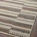 Angle showing corner and partial edge of rug on wood floor with uniform pattern
