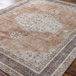 Close-up angled view of Lila rug showing detailed woven pattern and faded color texture on a wooden floor