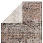 Revealed reverse side of Elio Oriental Gray Black rug showing lighter woven backing texture