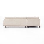 Back view of sectional highlighting clean lines and wooden base under pewter upholstery