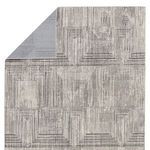 Folded corner revealing woven polypropylene and polyester backing in light gray
