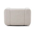 Close-up of armrest curve and fabric seam accentuating upholstery quality