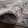 Close-up of the rug folded to highlight softness and power-loomed polypropylene pile