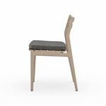 Side angle of Atherton chair emphasizing open seat slats under ash cushion and chair leg structure