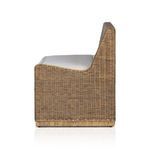 Close-up of armrest and seat cushion edge with visible rattan binding
