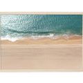 Framed aerial ocean photography with blue waves meeting sandy beach featuring detailed water texture and sand patterns