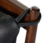 Close-up of leather cushion top showing subtle creases and smooth surface