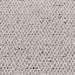 Macro shot of beige woven fabric upholstery with flecks of brown and red threads