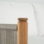 Close-up of teak wood post with rounded top and beige fabric wrapping on Pacifica Loveseat