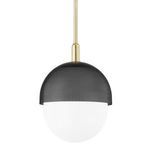Medium pendant light with perforated black metal dome over white glass globe and brass hanging rod