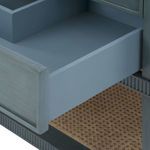 Interior view of open drawer showing light blue painted wood interior and smooth drawer slides
