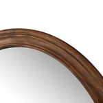 Close-up detail of warm chestnut wood grain and finish on curved outer frame