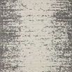 Rectangular indoor/outdoor rug with an ivory background and irregular grey textured pattern