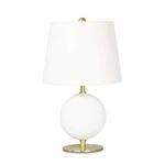 Compact table lamp with white spherical metal base, natural brass finish, and tall natural linen shade
