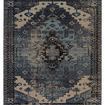 Indoor-outdoor rug with a bold tribal medallion pattern in blue and gray tones, inspired by antique Turkish rugs.