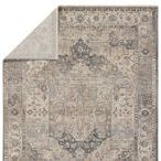 Reverse side folded over revealing backing material and lighter underside of rug