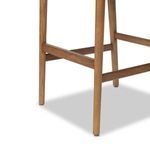 Close-up of wood legs and horizontal support bars with subtle wood texture