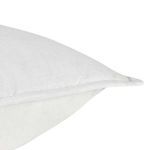 Close-up of sham edge showing finely sewn piping detail with smooth cloud white ramie fabric
