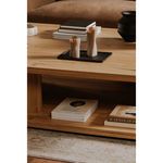 Wooden tray with decorative candles on table top; lower shelf shows magazines and books