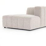 Back view of sectional piece displaying vertical channel quilting on sturdy sandstone fabric