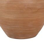 Close-up showing textured terracotta base curvature and color variations