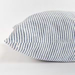 Close-up of Otis Pinstripe Pillow featuring the narrow blue pinstripe pattern on white flax fabric.