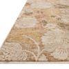 Angled close-up showing low pile, soft texture, and detailed floral pattern with beige and yellow hues