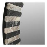 Close-up detail of the textured matte leathered black and light marble segments on Isolde mirror frame