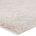 Close-up showing cut-loop pile texture and detailed pattern in soft taupe and cream colors