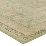 Close-up of rug corner shows wool texture and hand-sheared vintage finish