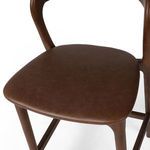 Close-up of seat with smooth top-grain leather upholstery in warm brown