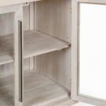 Close-up interior shot of adjustable wooden shelves and metal hardware on open door