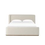 Light beige Performance fabric-upholstered bed with cushioned head and footboards, plinth ash base, and clean lines