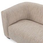 Top-angle close-up showing cushioned seat and arm intersection with textured upholstery