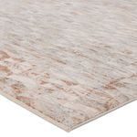 Close-up angled view showing rug’s slight high-low pile and soft texture in earthy colors