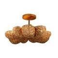 Anguilla semi-flush mount lit from within, highlighting warm glow and natural wood bead shading