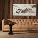 Illumination IV By Matera painting displayed horizontally above tan tufted sofa with wood slat wall background