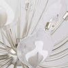 Angled close-up highlighting textured glass shade and inner metal leaf detail
