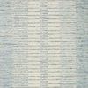 Soft wool rug with a multi-tonal blue and cream striped pattern in a modern traditional style