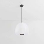 Pendant light viewed slightly higher showing the lit opal glass core inside the frosted glass shade