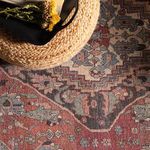 Close-up of rug surface under natural light with woven texture and muted color palette