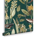 Rolled wallpaper showing full-scale bird and flower design with green background and intricate botanical details